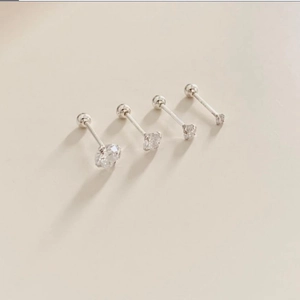 Set of four 925 sterling silver stud earrings with round zircons in various sizes