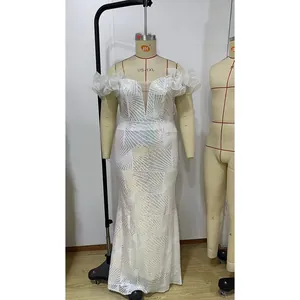 Detail of white sequin plus size mermaid dress featuring ruffled off-shoulder sleeves