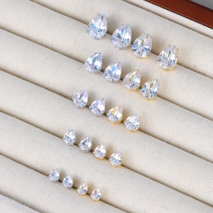 Detailed comparison of pear-cut cubic zirconia stud earrings in gold and silver settings