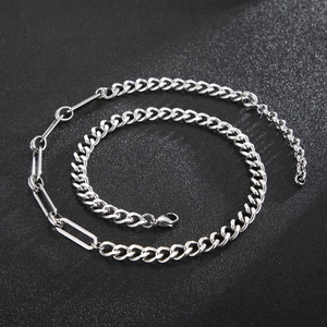 Detail of silver stainless steel paperclip and cuban link necklace with lobster clasp