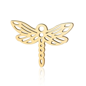 Macro shot of a golden dragonfly pendant with hollow design and high-polish finish