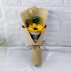 Detail of single soap sunflower and eucalyptus wrapped in kraft paper with Best Wishes tag