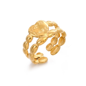 Minimalist gold heart ring featuring double layer beaded band and unique engraving