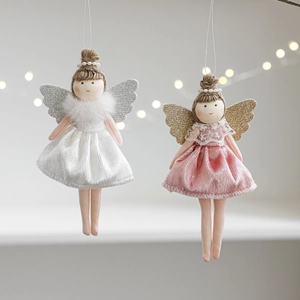 Detailed view of handmade angel doll ornaments with velvet dresses and glitter wings