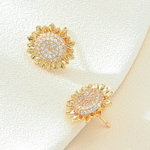 Elegant gold sunflower stud earrings featuring sparkling zircon inlay on neutral fabric