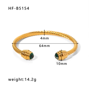 Detail of 18k gold plated twisted cuff bracelet with green gemstones and dimensions