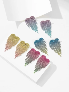 Detailed view of heart-shaped tassel earrings featuring colorful rhinestone gradients
