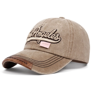 Washed vintage khaki baseball cap with Los Angeles embroidery and leather brim accent