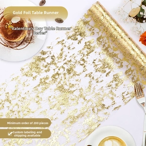 Close-up of bohemian cheesecloth table runner with gold foil detailing and soft textures