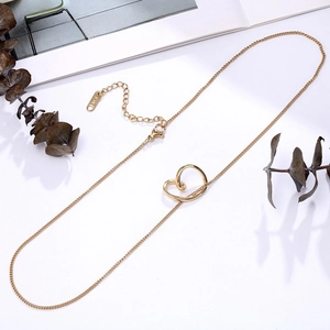 Close-up of 14K gold minimalist twisted heart pendant with polished fine chain details