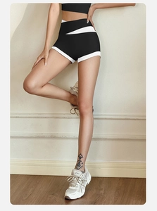 Close-up of high-waist yoga shorts with black and white contrast side panel stitching