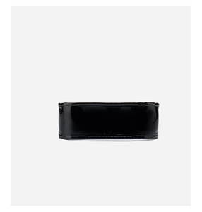 Detail shot of the sleek black patent leather finish on this trendy crossbody handbag