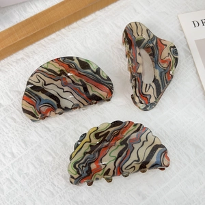Three acrylic hair claws with colorful oil painting marble texture on white background
