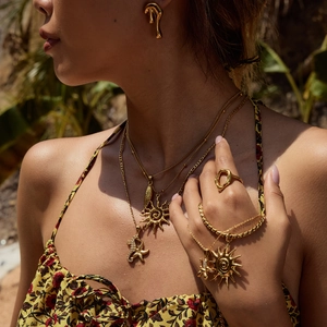 Luxe gold stainless steel necklace set with sun and seahorse pendants for women