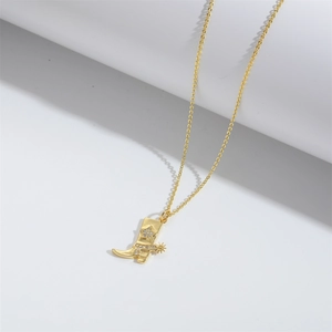 Detail view of gold boot pendant necklace with star motif and sparkling rhinestones
