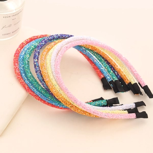 Set of seven sparkling glitter headbands in assorted vibrant colors for festive hair styling