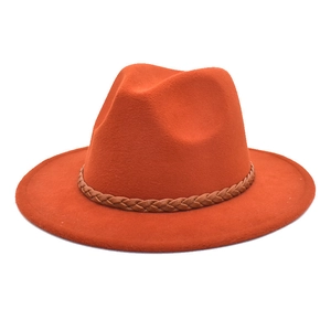 Detail of the rust orange fedora hat with a brown woven rope decorative band