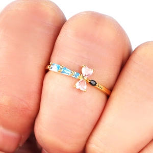 Double-layered gold dragonfly ring with pink heart zircons and blue gemstones