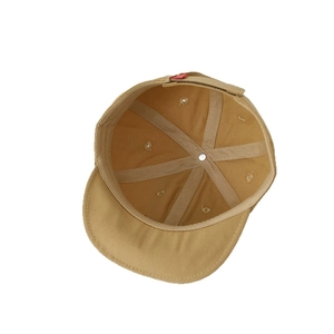 Internal view of khaki cotton canvas kids baseball cap with premium stitching and red label