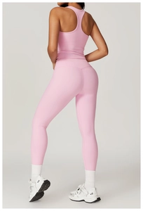 Detail view of pink racerback sports top and high-waisted compression yoga leggings