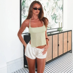 Light green knit halter top with white silk tie-up shorts set for casual summer wear