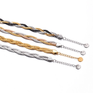 Detail of woven stainless steel chain bracelets in gold silver and rose gold finishes