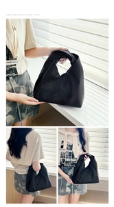 Detail shot of black lychee texture PU leather cloud bag with elegant pleated design