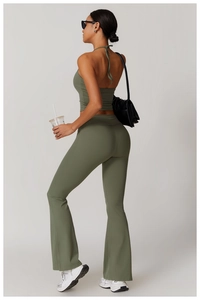 Detail of olive green halter neck yoga top and flared leggings showing backless design
