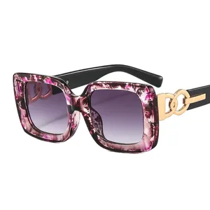 Chic purple tortoiseshell square sunglasses with gold metal logo and gradient lenses