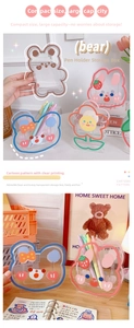 Detailed view of clear acrylic pen holders with cute cartoon bear and rabbit patterns