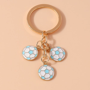 Detail of metal keychain with three mini blue and white enamel soccer ball charms