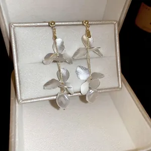 Exquisite long floral tassel earrings with silver petals and baroque pearl detail
