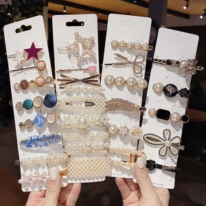 Elegant pearl and rhinestone hair clip set featuring various artistic designs for women