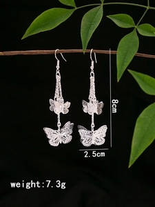 Detailed view of silver butterfly tassel earrings with 8cm length and weight dimensions