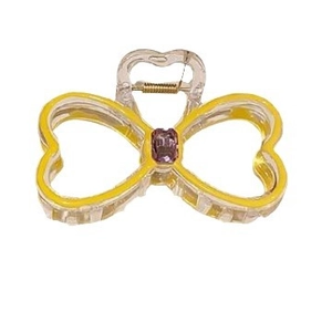 Sparkly rhinestone bow hair claw clip in yellow resin with purple gemstone center