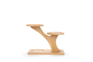 Three-tier bamboo plant stand with tree-shaped structure and round trays on white background