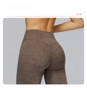 Detail view of high-waist yoga pants featuring V-shaped seam and marled brown texture