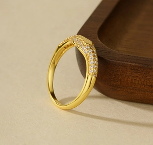Macro shot of gold-plated 925 silver ring featuring detailed micro-pave white zircon setting