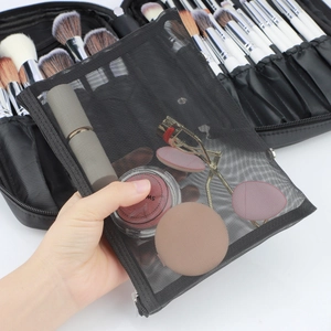 Close-up of translucent black mesh zipper pouch and portable makeup brush storage case