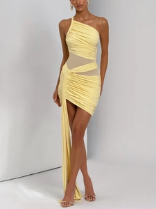 Detail of light yellow one-shoulder dress with mesh splicing and draped fabric detail