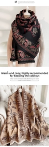 Detailed view of paisley cashmere pashmina shawl featuring delicate fringe and floral weave