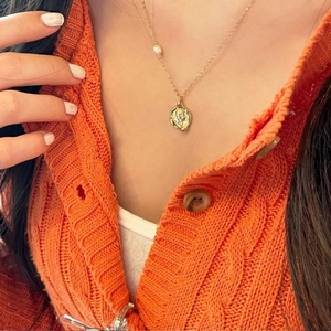 925 Sterling silver gold coin pendant necklace with pearl detail on a model