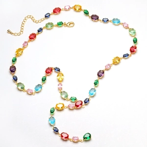 Close-up of multicolored oval crystal link necklace with 18K gold-plated chain and lobster clasp