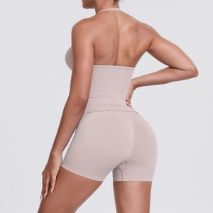 Close-up of beige high-waist yoga shorts showing seamless texture and peach-lift effect