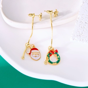 Detailed view of asymmetrical Christmas earrings with Santa Claus and wreath charms