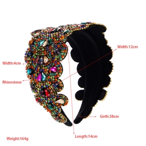 Detail view of wide sparkling rhinestone headband with dimensions and baroque design