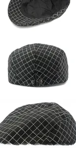 Detail view of cotton houndstooth flat cap featuring adjustable metal snap and inner lining