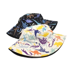 Double-sided cotton bucket hats with dinosaur silhouette prints in black and white colors
