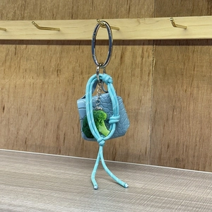 Blue mini crocodile texture handbag and broccoli charm keychain on woven rope