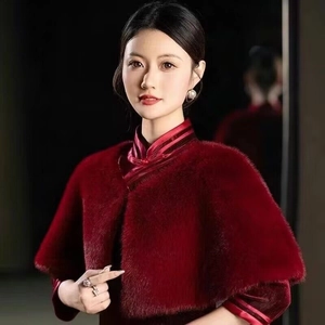 Detail of red faux fur shawl paired with a qipao for winter evening wedding events